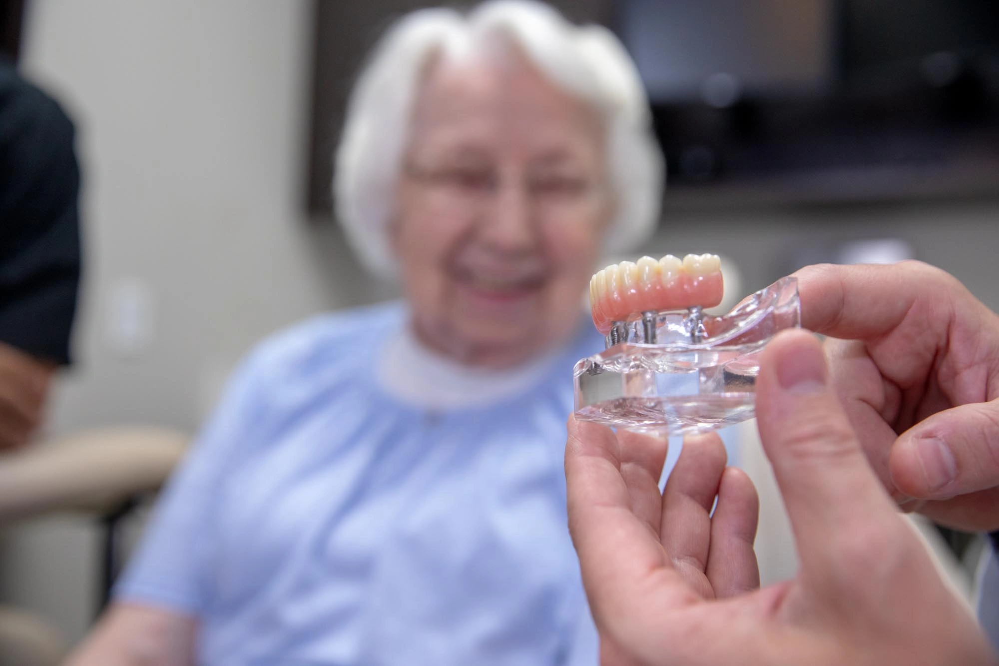Snap-on dental implant dentures providing secure, comfortable smiles in Kansas City